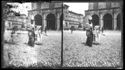 Una donna e una bambina a passeggio davanti al palazzo del Podestà in piazza Vittorio Emanuele II: prospetto della piazza del Nettuno: Bologna