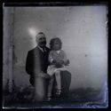 Alfredo Forti con una bambina seduta sulla sua gamba: lato est della villa di Gaibola, detta la Vigna: Bologna