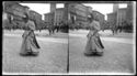 Una donna a passeggio in piazza Vittorio Emanuele II: prospetto della piazza del Nettuno: Bologna