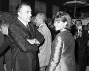 Federico Fellini e Claudia Cardinale alla festa in occasione della consegna dell’Oscar per il film «8 ½». Teatro di posa Safa-Palatino al Celio - Roma, 26.4.1964 