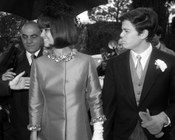 Claudia Cardinale, con abito di Nina Ricci, assieme al fratello il giorno delle nozze della sorella Blanche Cardinale e Mario Forges Davanzati. Roma, 11.2.1965