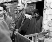 Alberto Moravia e Natalia Ginzburg in visita alla borgata Prenestino. Roma, 15.2.1956